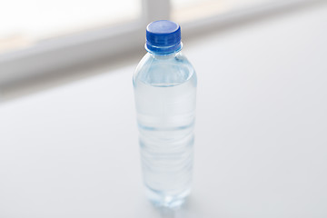 Image showing close up of bottle with drinking water on table