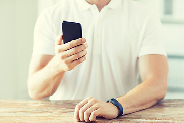 Image showing close up of man with smart phone and watch