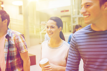 Image showing group of smiling students with paper coffee cups