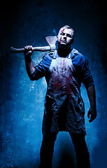 Image showing Bloody Halloween theme: crazy killer as bloody butcher with an ax