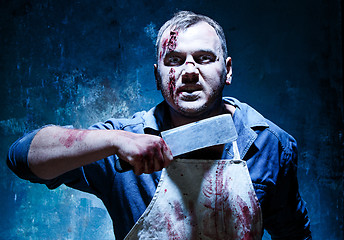 Image showing Bloody Halloween theme: crazy killer as butcher with a knife