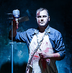 Image showing Bloody Halloween theme: crazy killer as butcher