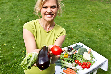 Image showing Cute blond girl with vegetables