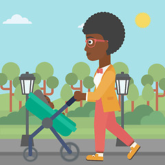 Image showing Mother walking with her baby in stroller.