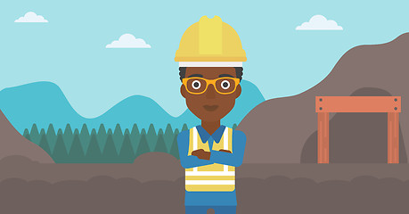 Image showing Miner with mining equipment on background.