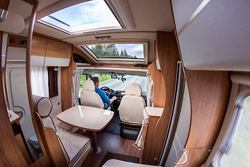 Image showing Man driving on a road in the Camper Van