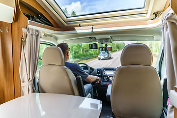 Image showing Man driving on a road in the Camper Van