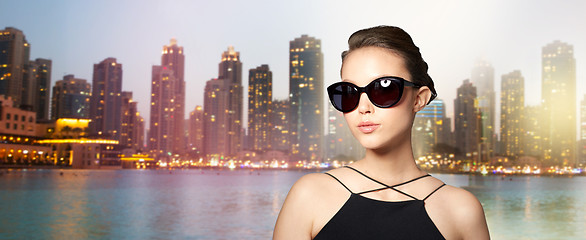 Image showing beautiful young woman in elegant black sunglasses