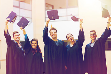 Image showing group of smiling students in mortarboards