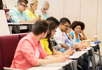 Image showing group of students with coffee writing on lecture