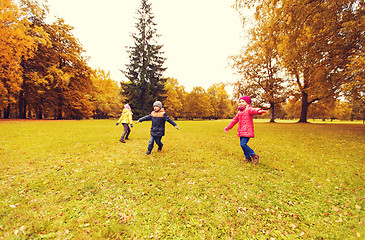 Image showing happy little children running and playing outdoors