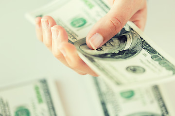 Image showing close up of woman hand counting us dollar money