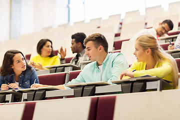 Image showing group of students with notebooks in lecture hall