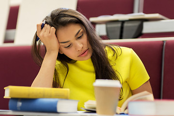 Image showing student girl with books and coffee on lecture