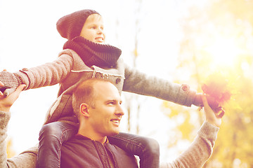 Image showing happy family having fun in autumn park