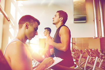 Image showing men exercising on treadmill in gym