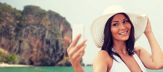 Image showing young woman taking selfie with smartphone