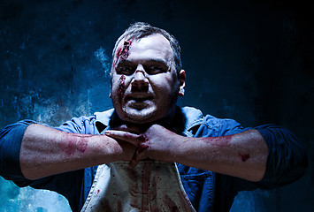 Image showing Bloody Halloween theme: crazy killer as butcher