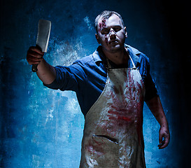 Image showing Bloody Halloween theme: crazy killer as butcher with a knife