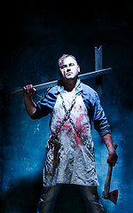 Image showing Bloody Halloween theme: crazy killer as butcher with an ax