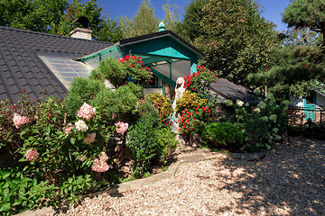 Image showing Dog baby house with flowers