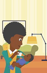 Image showing Mother feeding baby.