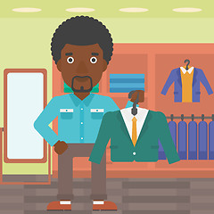 Image showing Man holding suit jacket in clothing store.