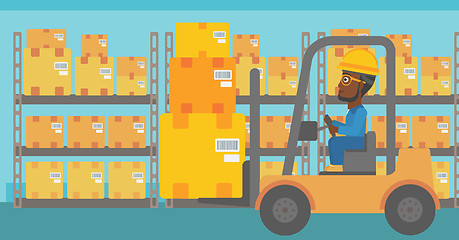 Image showing Warehouse worker moving load by forklift truck.