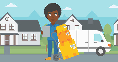 Image showing Delivery woman with cardboard boxes.