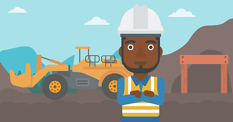 Image showing Miner with mining equipment on background.