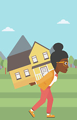 Image showing Woman carrying house vector illustration.