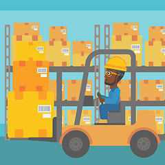 Image showing Warehouse worker moving load by forklift truck.