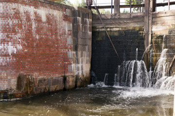 Image showing old leaking dam