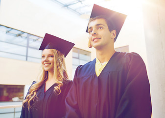 Image showing group of smiling students in mortarboards