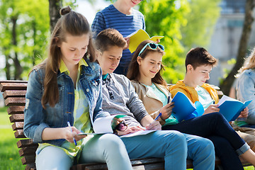 Image showing group of students with notebooks at school yard