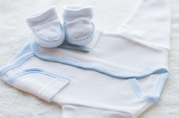 Image showing close up of baby boys clothes for newborn on table