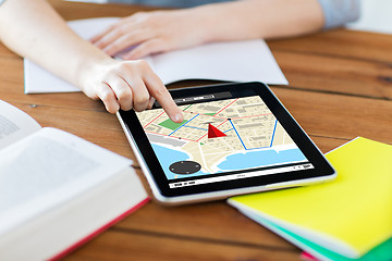 Image showing close up of student with tablet pc and notebook