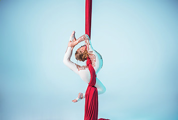 Image showing Graceful gymnast performing aerial exercise