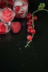 Image showing Frozen berries on wooden table