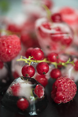 Image showing Frozen berries on wooden table