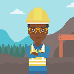 Image showing Miner with mining equipment on background.