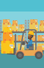 Image showing Warehouse worker moving load by forklift truck.