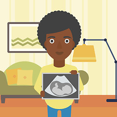 Image showing Pregnant woman with ultrasound image.