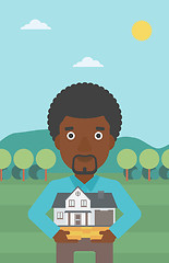 Image showing Man holding house model vector illustration.