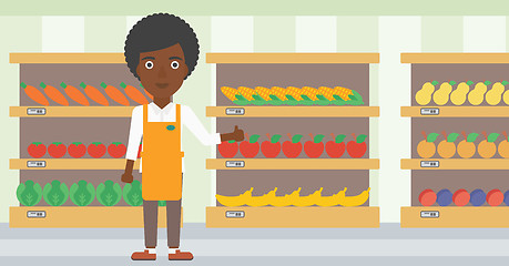 Image showing Friendly supermarket worker vector illustration.