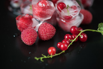 Image showing Frozen berries on wooden table