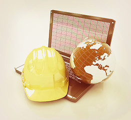 Image showing Hard hat and earth on a laptop . 3D illustration. Vintage style.