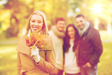 Image showing group of friends having fun in autumn park