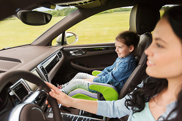 Image showing happy woman with little girl driving in car