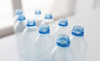 Image showing close up of empty used plastic bottles on table